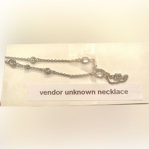 Silver necklace.